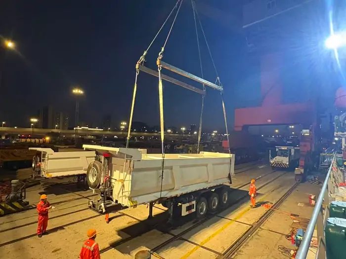 Dump Semi Trailer Loaded onto a Ship at the Port 2